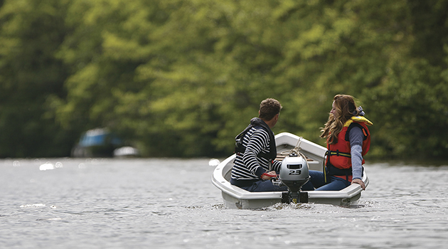 Two people in a boat being propelled by a BF 2.3