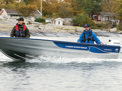 Two people in a moving fishing boat 